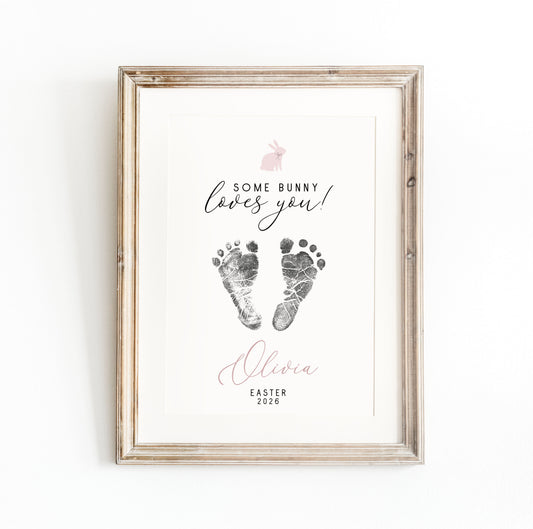 Framed keepsake with baby footprints and text 'Some bunny loves you! Olivia Easter 2020' on a white background