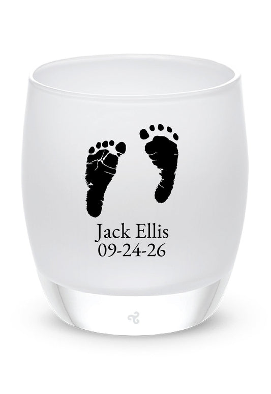 Glassybaby tea candle holder with footprints and text on a white background