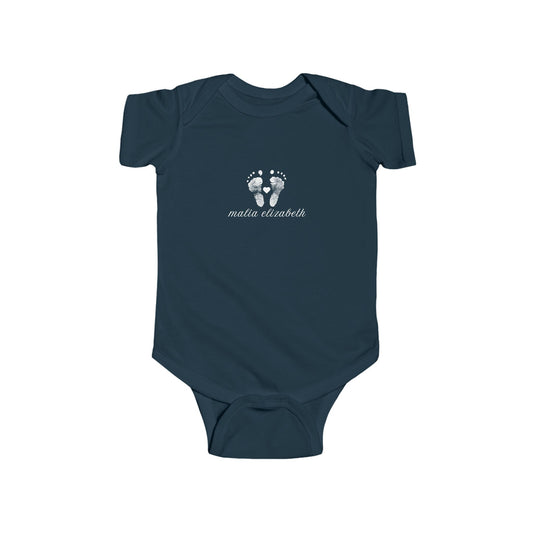 Navy blue baby onesie with white footprint design.