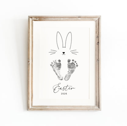 Framed keepsake with a bunny design, baby's footprints and 'Easter 2026' text on a white background