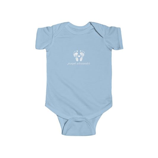 Light blue baby onesie with white footprint design.