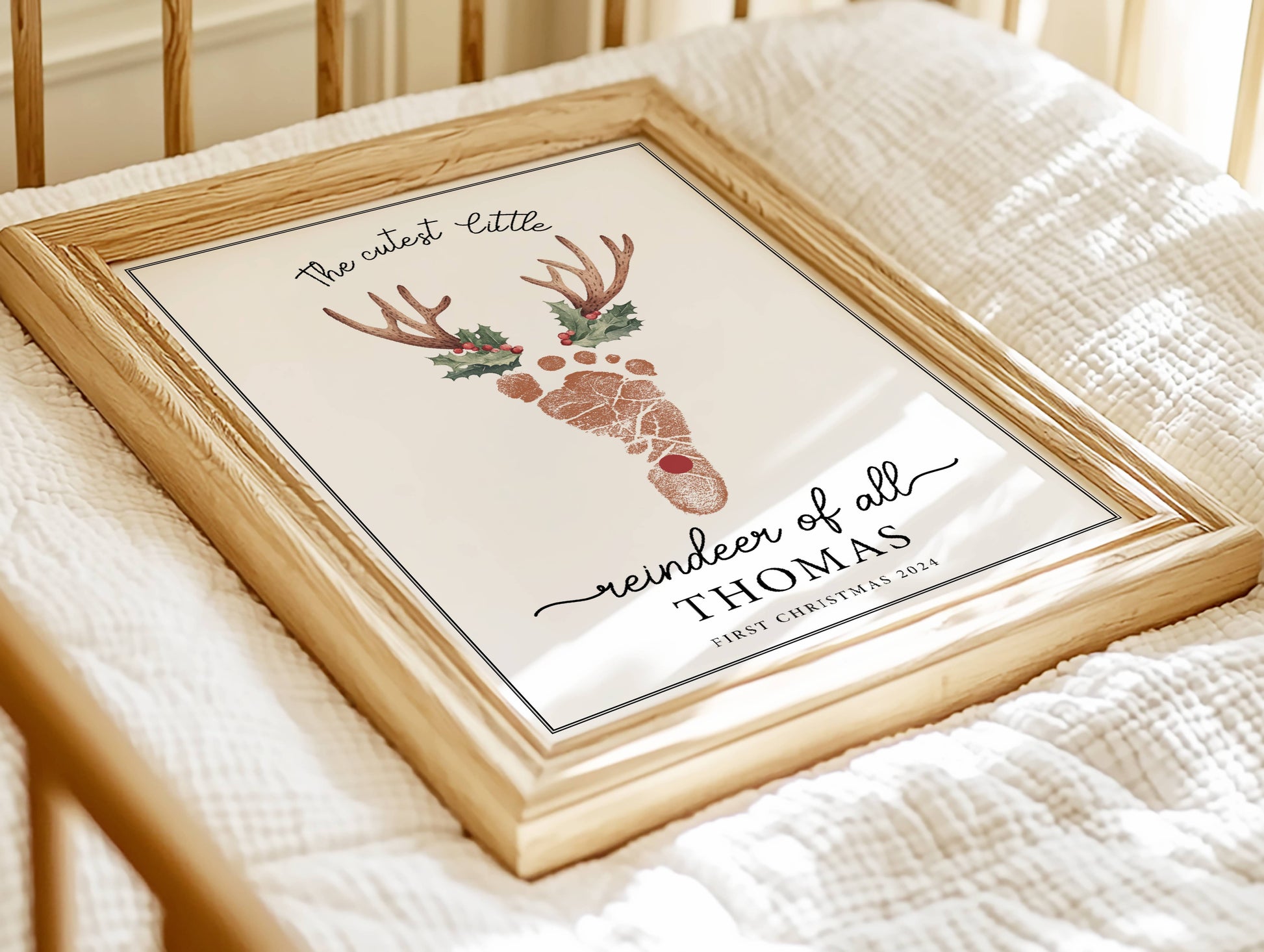 A Custom wallpaper baby footprint Christmas art framed sitting in the infant crib