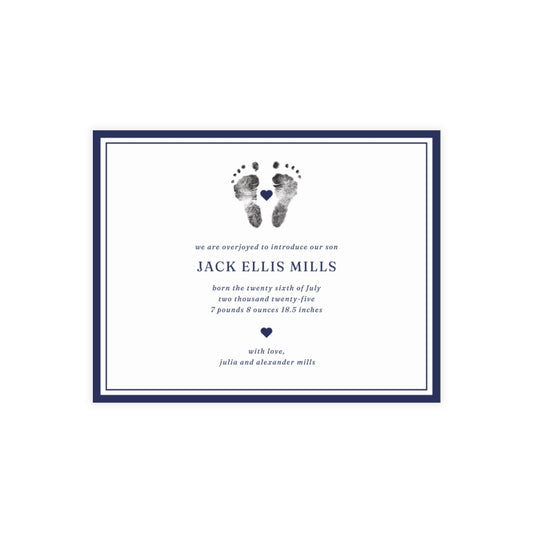 Newborn baby announcement card with footprints and text on a white background