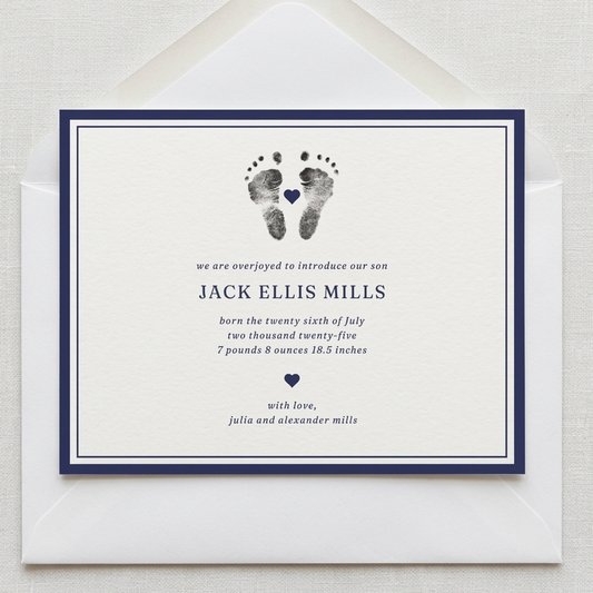Newborn baby announcement card with footprints and text on a white background