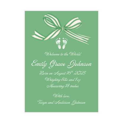 Green birth announcement card with a white bow and baby footprint design.