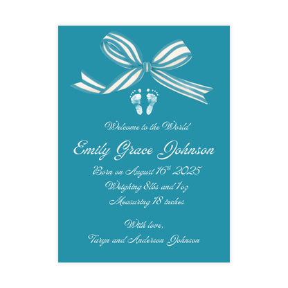 Light blue birth announcement card with a white bow and baby footprint design.
