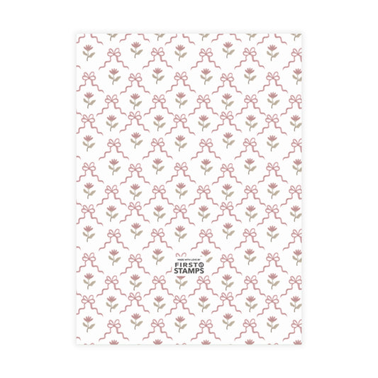 Red patterned paper with floral and bow design on a white background. First Stamps logo at bottom.