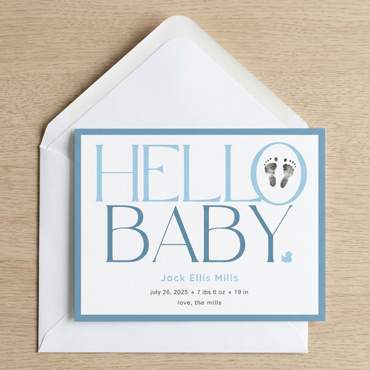 Baby footprint announcement card with 'Hello Baby' text and footprints on a white envelope