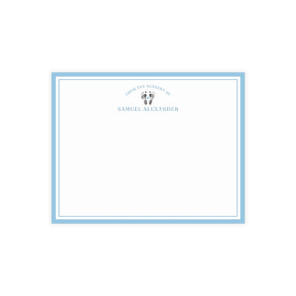 White card with baby footprints, light blue border and text on a white background