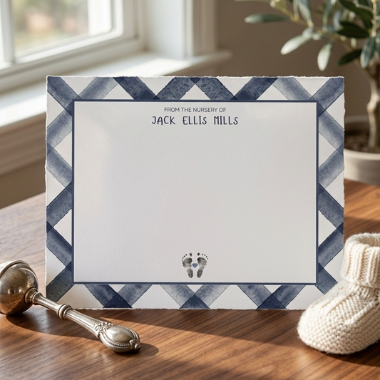 Card with zigzag border and text 'From the nursery of Jack Ellis Mills' on a white background with baby footprints.