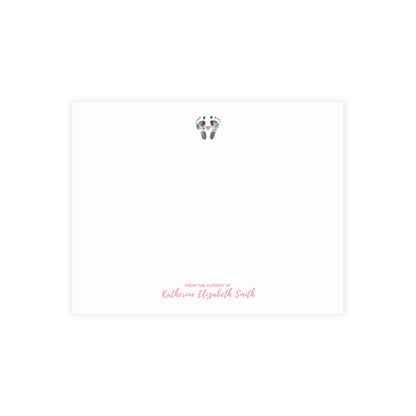 Baby footprints on a white background with 'Katherine Elizabeth Smith' text.