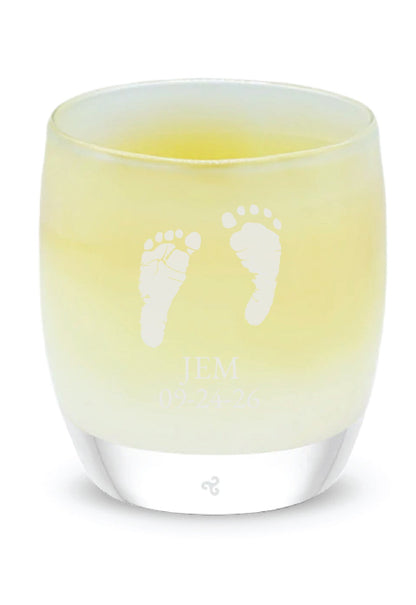 Glassybaby candle with footprints in angel color on a white background