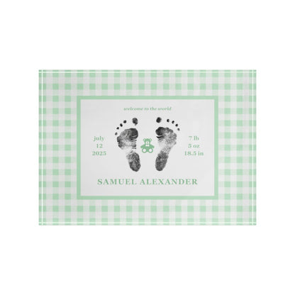 Green acrylic block with  baby footprints and text.